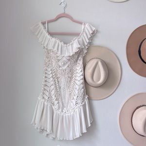 Saints + Secrets White and nude lace off the shoulder ruffle dress.